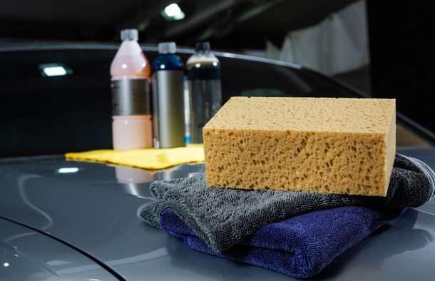 Close up of cleaning products on a car bonnet